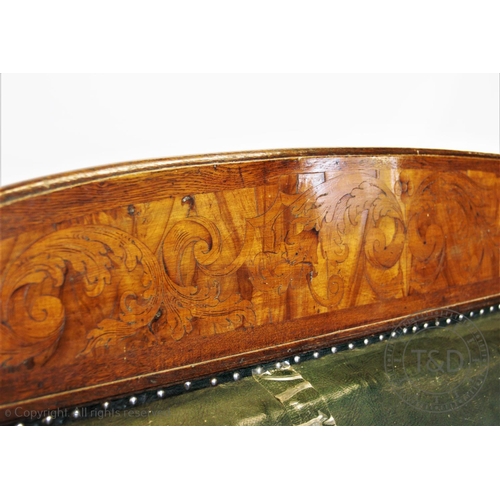 790 - A mid 19th century oak, walnut and green leather library sofa, possibly German, the arched rail back... 