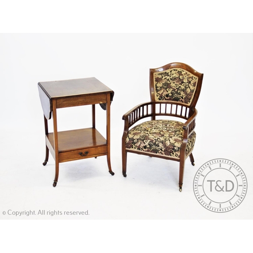 803 - An Edwardian inlaid mahogany low seat open armchair, with a padded back above slender arms and squar... 