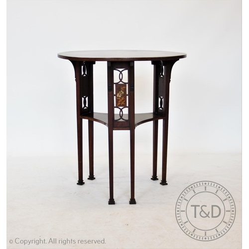 813 - An early 20th century Art Nouveau mahogany occasional table, the circular top supported on three pai... 