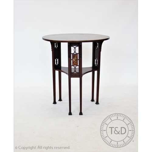 813 - An early 20th century Art Nouveau mahogany occasional table, the circular top supported on three pai... 