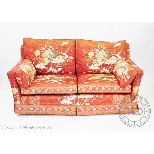 815 - A three piece chinoiserie lounge suite, to include a three seater settee, armchair and foot stool, a... 