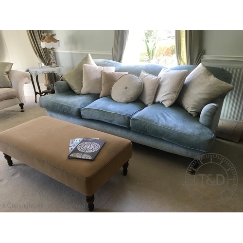 828 - A contemporary three seater sofa, in duck egg blue chenille upholstery, the triple padded back above... 