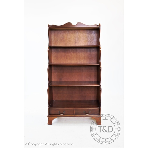 833 - A modern yew wood waterfall bookcase, 150cm H x 77cm W x 38cm D