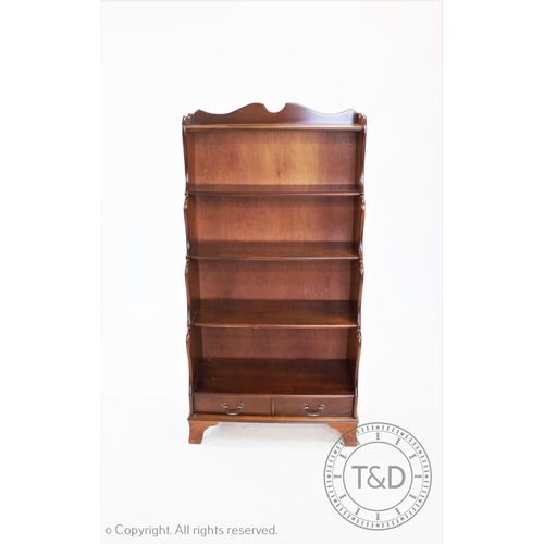 833 - A modern yew wood waterfall bookcase, 150cm H x 77cm W x 38cm D