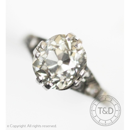 223 - A diamond solitaire ring, the oval old cut diamond (weighing approx. 2.80 carats), within split claw... 