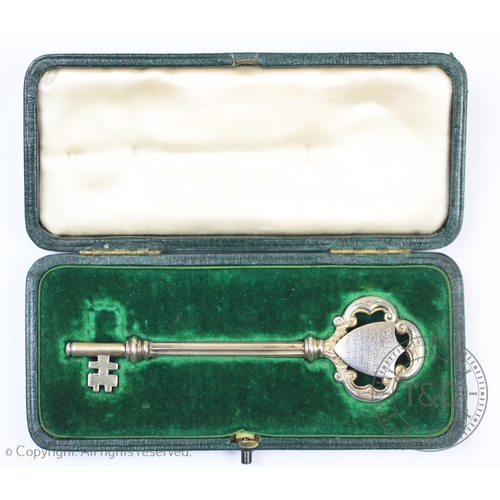 33 - A silver presentation key, for the Burslem Industrial Co-operative Society Milton Branch, engraved i... 