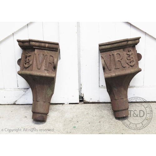 839 - A pair of Victorian cast iron corner gutter hoppers, of typical tapering form applied with the initi... 