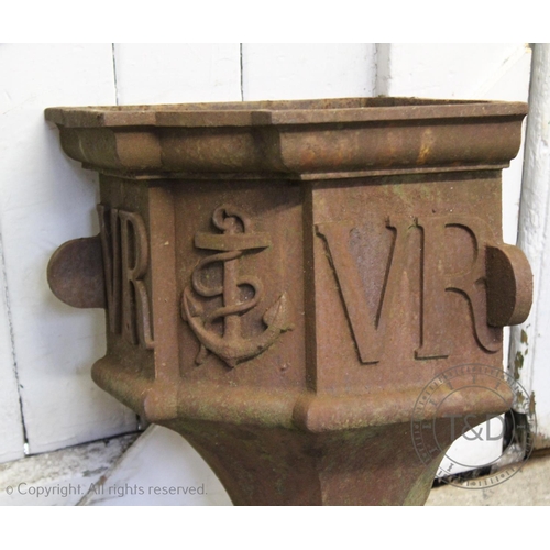 839 - A pair of Victorian cast iron corner gutter hoppers, of typical tapering form applied with the initi... 