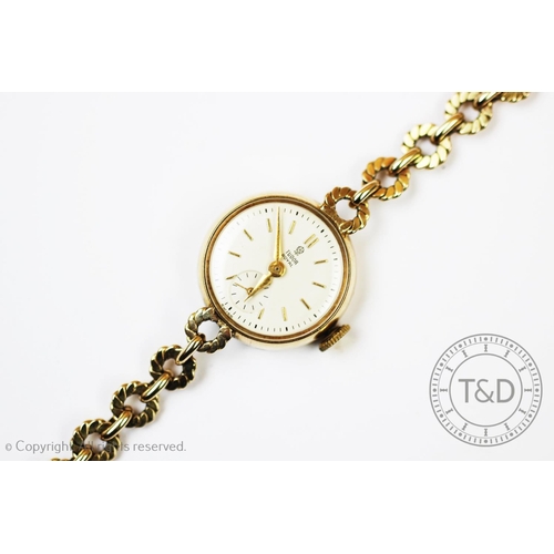 94 - A 9ct gold lady's Tudor wristwatch, Chester 1955, the case enclosing a white enamel dial with gold b... 