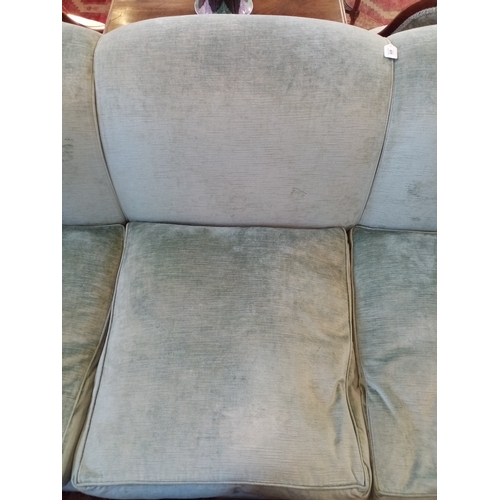 828 - A contemporary three seater sofa, in duck egg blue chenille upholstery, the triple padded back above... 