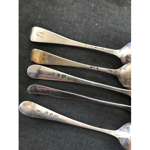 25 - A selection of silver flatware to include a pair of George III silver Old English pattern tablespoon... 