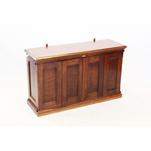 804 - A late 19th century American red walnut Amberg cabinet, the rectangular moulded top above a pair of ... 