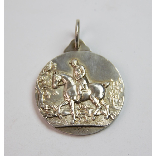 14 - A George V silver medal, Frank Hyams Ltd, Birmingham 1912, inscribed 'Hunters Improvement & National... 