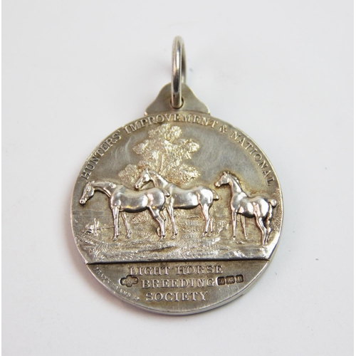 14 - A George V silver medal, Frank Hyams Ltd, Birmingham 1912, inscribed 'Hunters Improvement & National... 