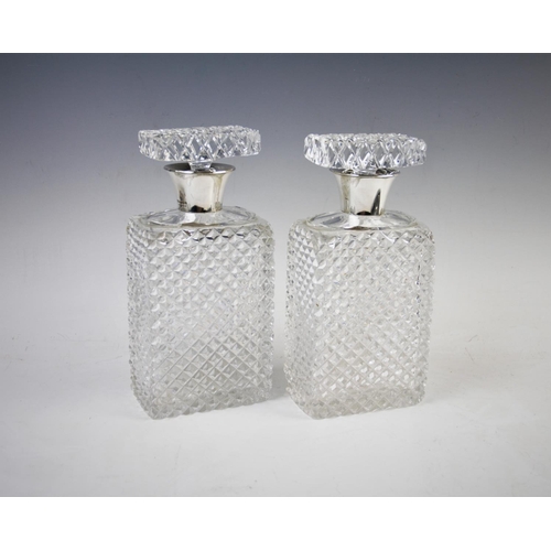 43 - A pair of silver mounted cut glass decanters, John Grinsell & Sons, Birmingham 1939, both of rectang... 