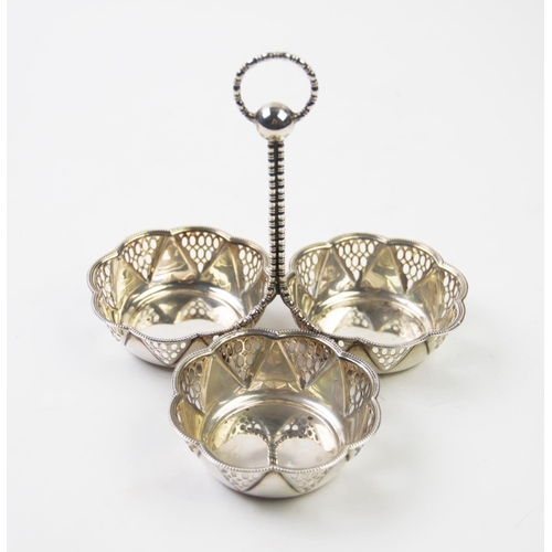 58 - An Edwardian silver centrepiece, Synyer & Beddoes, Birmingham 1913, designed as three pierced dishes... 