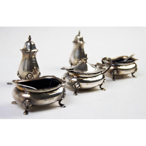 6 - A George V silver condiment set, Walker & Hall, Birmingham 1925, comprising: a pair of pepperettes, ... 