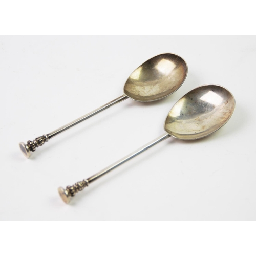 71 - Two George V silver seal top spoons, with plain polished bowls, the moulded finials with a blind sea... 