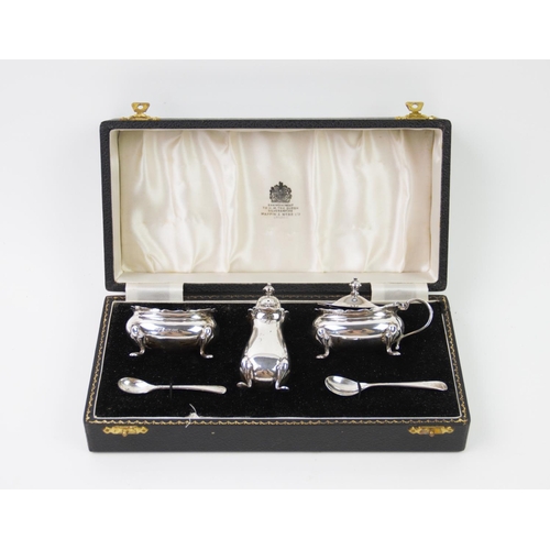 76 - A cased silver condiment, Mappin & Webb Ltd, Birmingham 1957, comprising: a pepperette, a salt and a... 