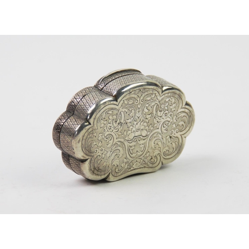 80 - An early 20th century continental white metal box, of oval scalloped form, with foliate designs to h... 