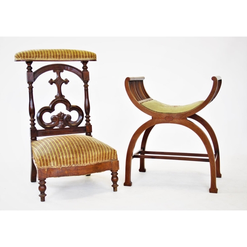 802 - A Victorian walnut prie dieu chair, with a padded top rail above an open work trefoil Gothic splat b... 