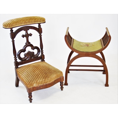 802 - A Victorian walnut prie dieu chair, with a padded top rail above an open work trefoil Gothic splat b... 