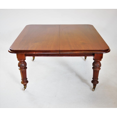 805 - A Victorian mahogany extending dining table, the rectangular moulded top with rounded corners, raise... 