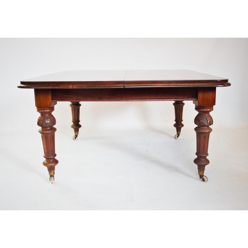 805 - A Victorian mahogany extending dining table, the rectangular moulded top with rounded corners, raise... 