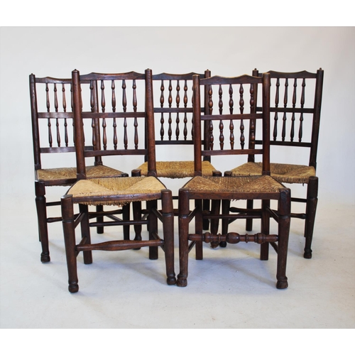 806 - A matched set of five early 19th century ash and elm spindle back country chairs, each with two rows... 