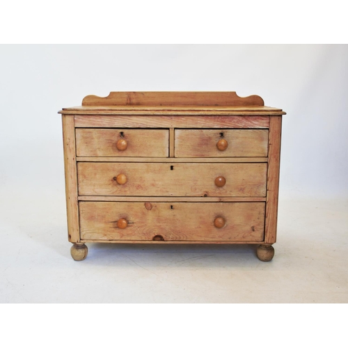 811 - A Victorian pine chest of two short and two long drawers, applied with knob handles, raised upon bal... 