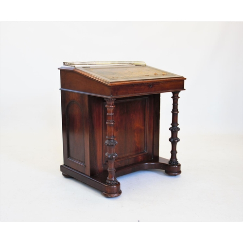 812 - A Victorian walnut davenport, the satinwood interior with six small drawers, upon two ring turned an... 