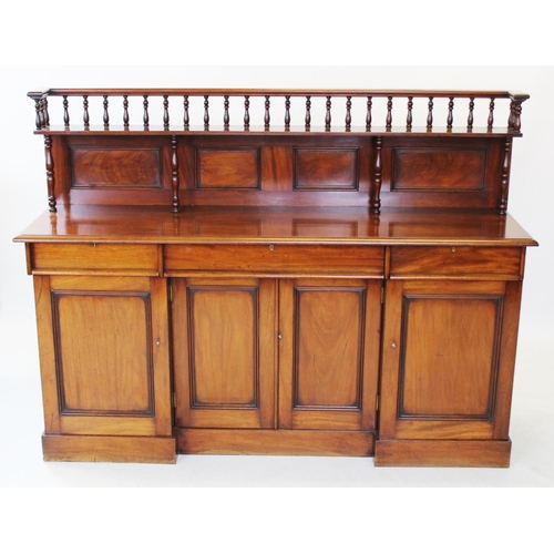 814 - A 19th century mahogany sideboard, the architectural raised back with a spindle gallery above a sing... 