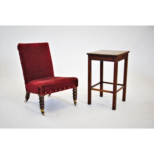 816 - A Victorian red velour low seat nursing chair, raised upon bobbin turned front legs and castors, 67c... 