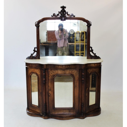 819 - A Victorian walnut mirror back chiffonier,the arched mirror with a carved leafy crest above the shap... 