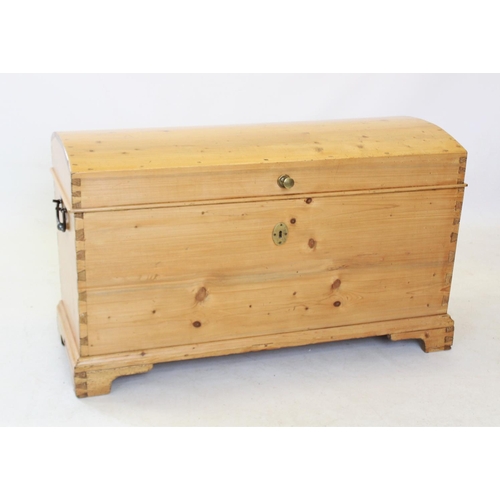 820 - A Victorian dome top pine trunk, of tapering form with a fitted candle box, raised upon bracket feet... 