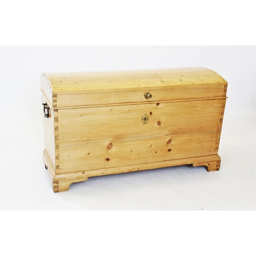 820 - A Victorian dome top pine trunk, of tapering form with a fitted candle box, raised upon bracket feet... 