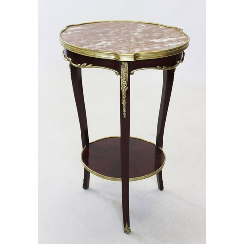 823 - An early 20th century French rouge marble top occasional table, the circular marble top raised upon ... 