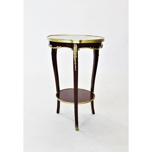 823 - An early 20th century French rouge marble top occasional table, the circular marble top raised upon ... 