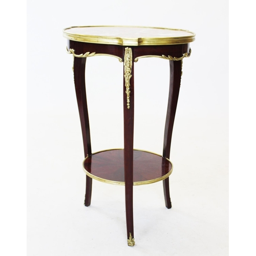 823 - An early 20th century French rouge marble top occasional table, the circular marble top raised upon ... 