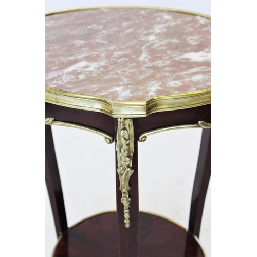 823 - An early 20th century French rouge marble top occasional table, the circular marble top raised upon ... 