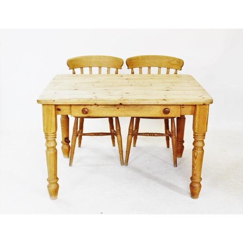 824 - A Victorian style pine slab top kitchen table, with a single frieze drawer, raised upon turned legs,... 