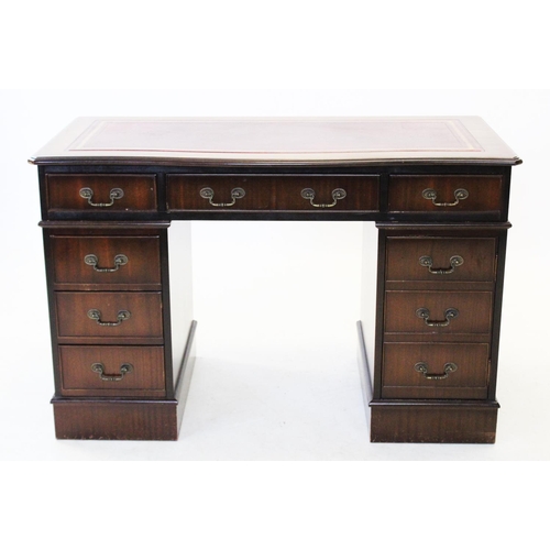 829 - A reproduction twin pedestal desk, late 20th century, with a serpentine top inset with a leather wri... 