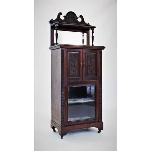 840 - An Edwardian walnut music cabinet,with a swans neck pediment above a single shelf and rectangular mi... 