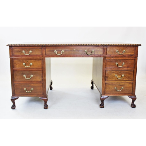 847 - A George II style mahogany desk, 20th century, having a gilt tooled leather writing surface within a... 