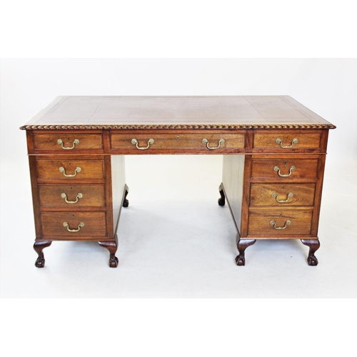 847 - A George II style mahogany desk, 20th century, having a gilt tooled leather writing surface within a... 