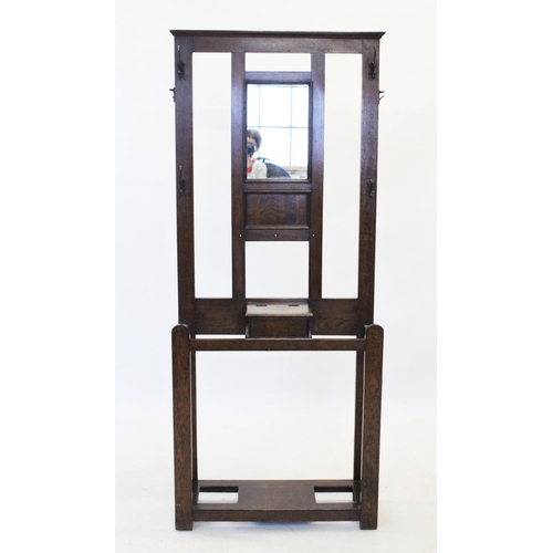 855 - An early 20th century oak hall stand, with a mirror back above a hinged glove box, 184cm H x 77cm W ... 