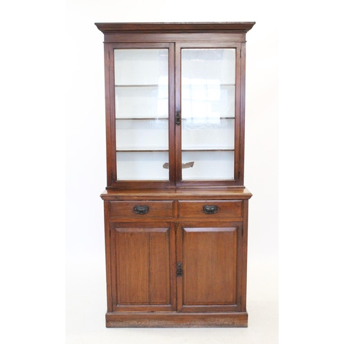 856 - An Edwardian walnut glazed library bookcase,with a moulded cornice above a pair of glazed doors encl... 