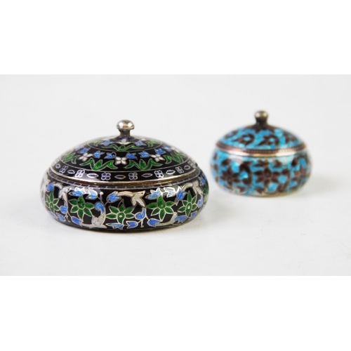 86 - A continental white metal and enamel detail pot and cover, 6.4cm diameter and a smaller example, 4cm... 