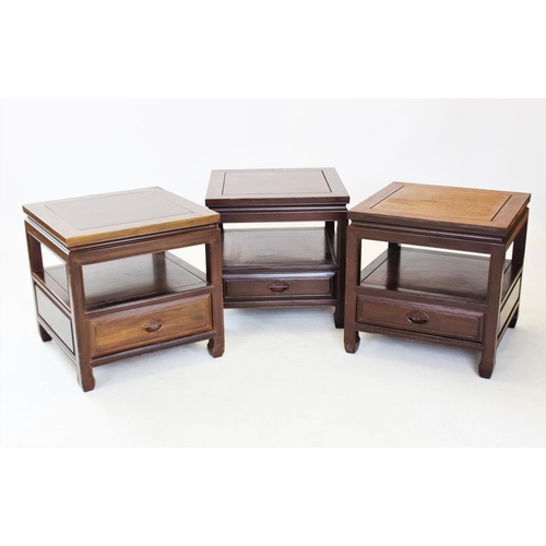 863 - A trio of Japanese influence rosewood lamp tables, the square tables with a lower shelf and frieze d... 