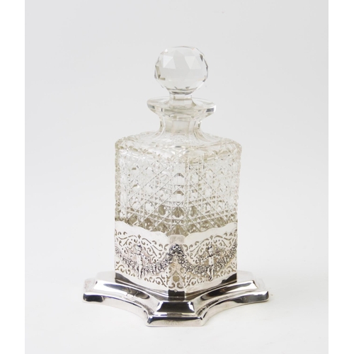 87 - An early 20th century cut glass decanter, with globular stopper, with an Edwardian quatreform silver... 